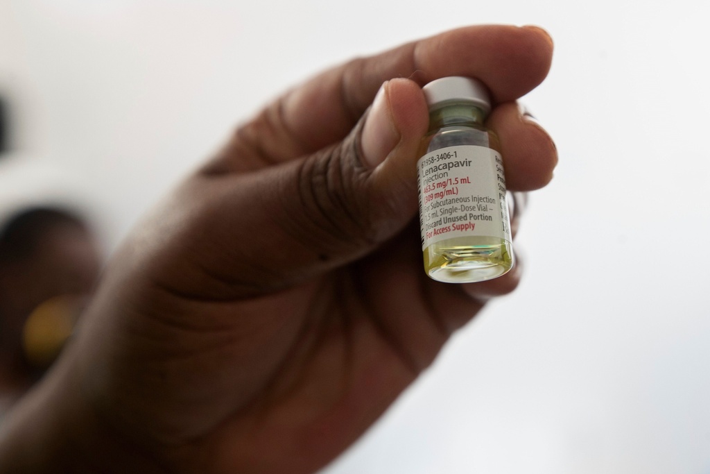 A nurse holds a vial of lenacapavir, a new HIV prevention drug, in Harare, Zimbabwe, Thursday, Feb. 19, 2026. (AP Photo/Aaron Ufumeli)