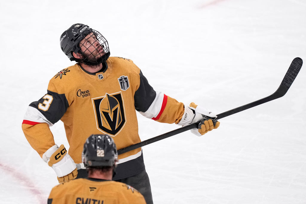 Vegas Golden Knights defenseman Brayden McNabb is seen with a cage on his helmet during the first period in Game 3 of the NHL hockey Stanley Cup Final series against the Carolina Hurricanes, Saturday, June 6, 2026, in Las Vegas. (AP Photo/Candice Ward)