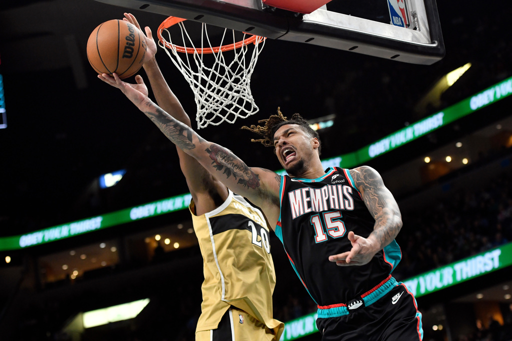 FILE - Memphis Grizzlies forward Brandon Clarke (15) shoots against Washington Wizards center Alex Sarr (20) in the first half of an NBA basketball game, Dec. 20, 2025, in Memphis, Tenn. (AP Photo/Brandon Dill)