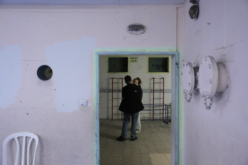 Civilians staying in a shelter after alarms announced that Israel had launched an attack on Iran, in Ramat Gan, Israel, Saturday, Feb. 28, 2026. (AP Photo/Oded Balilty)
