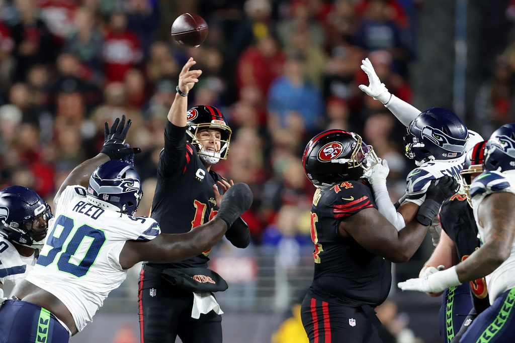 San Francisco 49ers Brock Purdy (13) throws an incomplete pass on fourth down against the Seattle Seahawks during the first half of an NFL football game in Santa Clara, Calif., Saturday, Jan. 3, 2026. (Scott Strazzante/San Francisco Chronicle via AP)