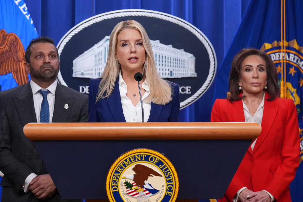 Attorney General Pam Bondi, joined at left by FBI Director Kash Patel, and Jeanine Pirro, U.S. Attorney for the District of Columbia, appear before reporters at the Justice Department, Friday, Feb. 6, 2026, in Washington, to announce the capture of a key participant in the 2012 attack on a U.S. compound that killed four Americans in Benghazi, Libya. (AP Photo/J. Scott Applewhite)
