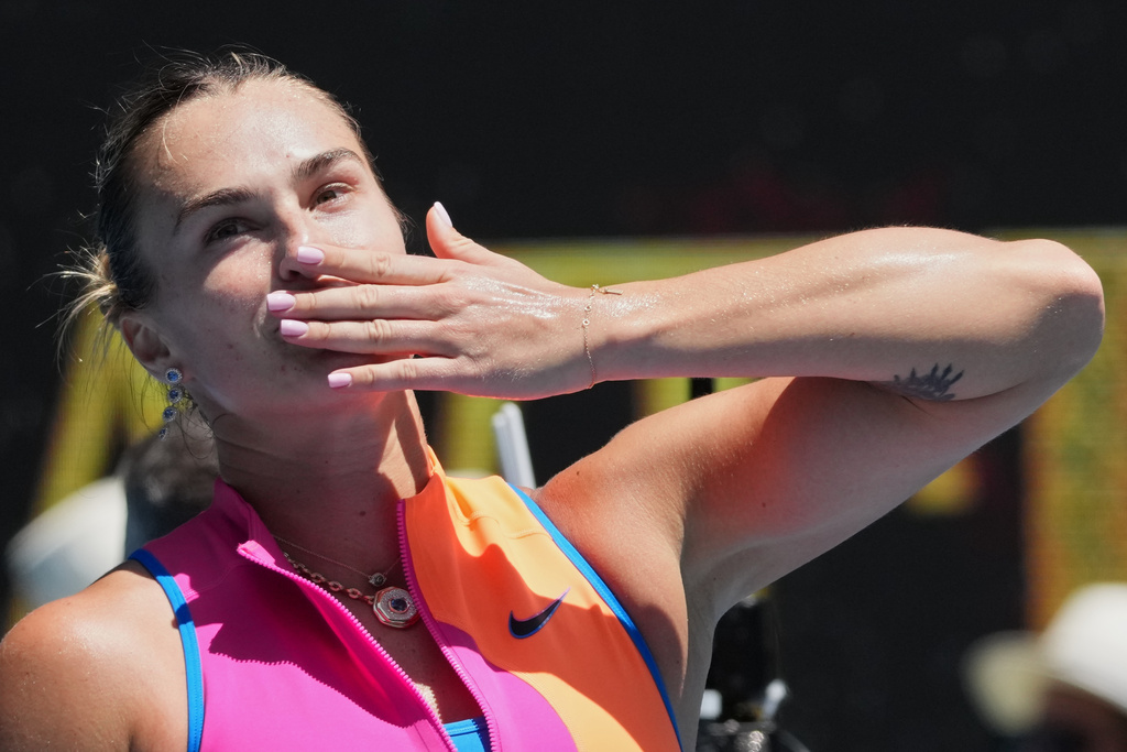 Aryna Sabalenka of Belarus celebrates after defeating Bai Zhuoxuan of China in their second round match at the Australian Open tennis championship in Melbourne, Australia, Wednesday, Jan. 21, 2026. (AP Photo/Dita Alangkara)