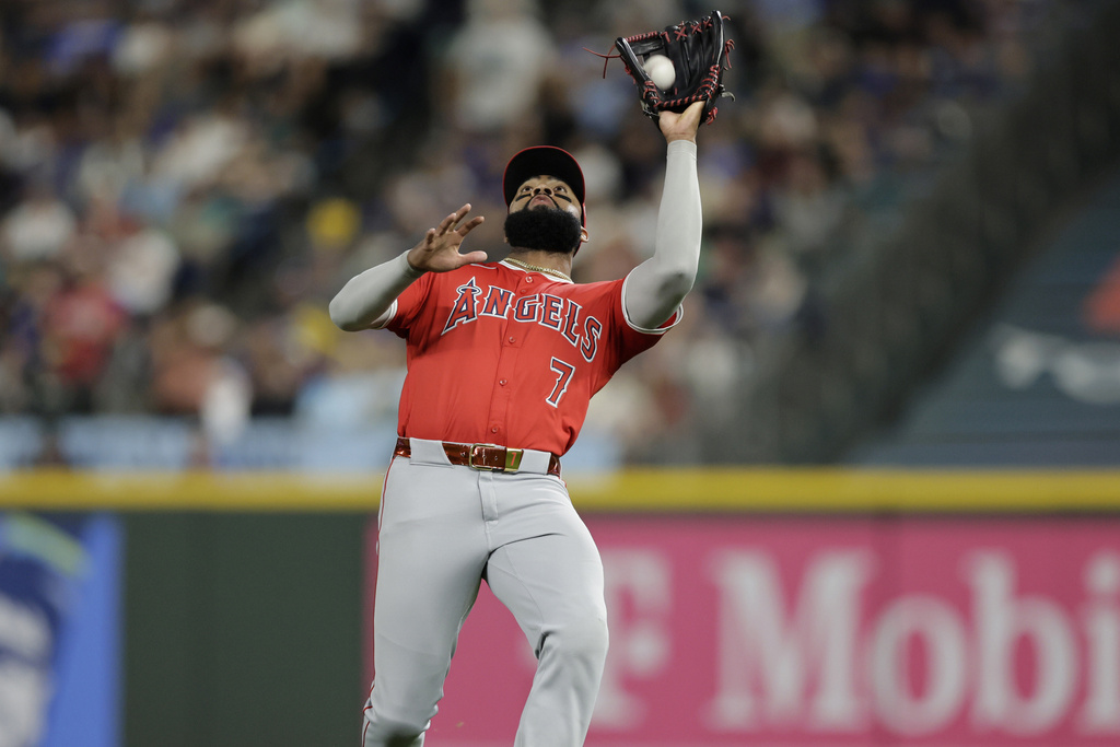 Los Angeles Angels right fielder Jo Adell catches a Seattle Mariners' Mitch Garver fly ball during the fifth inning of a baseball game Saturday, Sept. 13, 2025, in Seattle. (AP Photo/John Froschauer)