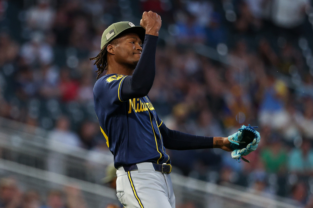 Milwaukee Brewers pitcher Abner Uribe celebrates after a double play to end the eighth inning of a baseball game against the Minnesota Twins, Friday, May 15, 2026, in Minneapolis. (AP Photo/Matt Krohn)