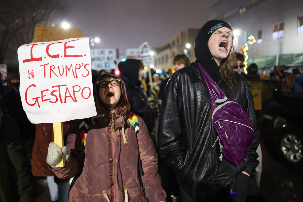 Protesters gather during a rally for Renee Good, Thursday, Jan. 8, 2026, in Minneapolis, after she was fatally shot by an ICE officer the day before. (AP Photo/Adam Bettcher)