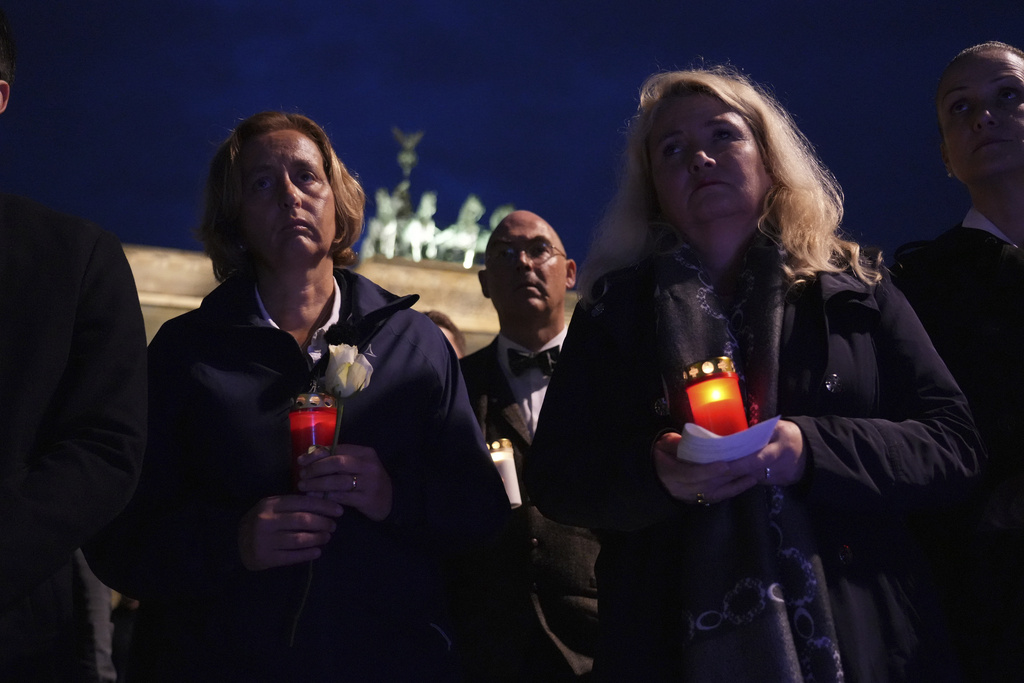 AfD member of the Bundestag Beatrix von Storch, left, and Berlin MP Kristin Brinker take part in a rally in front of the US Embassy in Berlin to express their grief over the attack on Charlie Kirk, in Berlin, Thursday, Sept. 11, 2025. (Manuel Genolet/dpa via AP)
