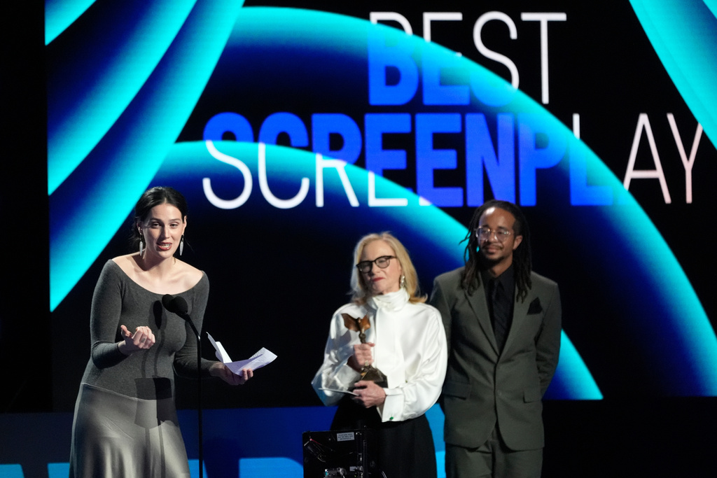 Eva Victor, left, accept the award for best screenplay for "Sorry, Baby" during the Film Independent Spirit Awards on Sunday, Feb. 15, 2026, at the Hollywood Palladium in Los Angeles. Amy Madigan looks on from right.(AP Photo/Chris Pizzello)