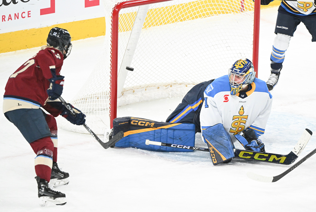 Toronto Sceptres goaltender Raygan Kirk (1) is scored on by Montreal Victoire's Natalie Mlynkova (not shown) as Victoire's Dara Greig (17) looks for a rebound during first period PWHL hockey action in Laval, Que., Wednesday, Jan. 28, 2026. (Graham Hughes/The Canadian Press via AP)