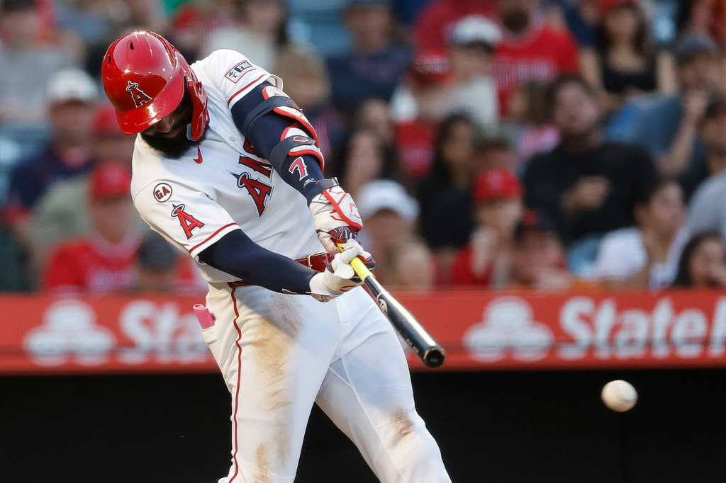 Los Angeles Angels' Jo Adell hits a two-run triple during the fourth inning of a baseball game against the Athletics, Saturday, June 27, 2026, in Anaheim, Calif. (AP Photo/Caroline Brehman)