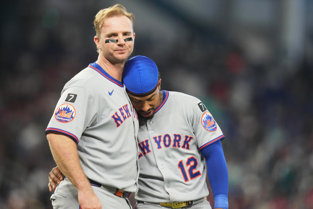 FILE - New York Mets' Pete Alonso, left, stands with Francisco Lindor after flying out with the bases loaded during the fifth inning of a baseball game against the Miami Marlins, Sunday, Sept. 28, 2025, in Miami. (AP Photo/Lynne Sladky, File)