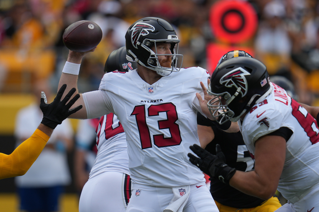 Atlanta Falcons quarterback Cooper Rush (13) looks to pass during an NFL football game against the Pittsburgh Steelers, Sunday, Sept. 13, 2026, in Pittsburgh. (AP Photo/Gene J. Puskar)