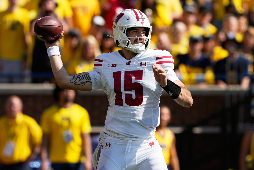 Wisconsin quarterback Hunter Simmons throws a pass during the first half of an NCAA college football game against Michigan, Saturday, Oct. 4, 2025, in Ann Arbor, Mich. (AP Photo/Ryan Sun)