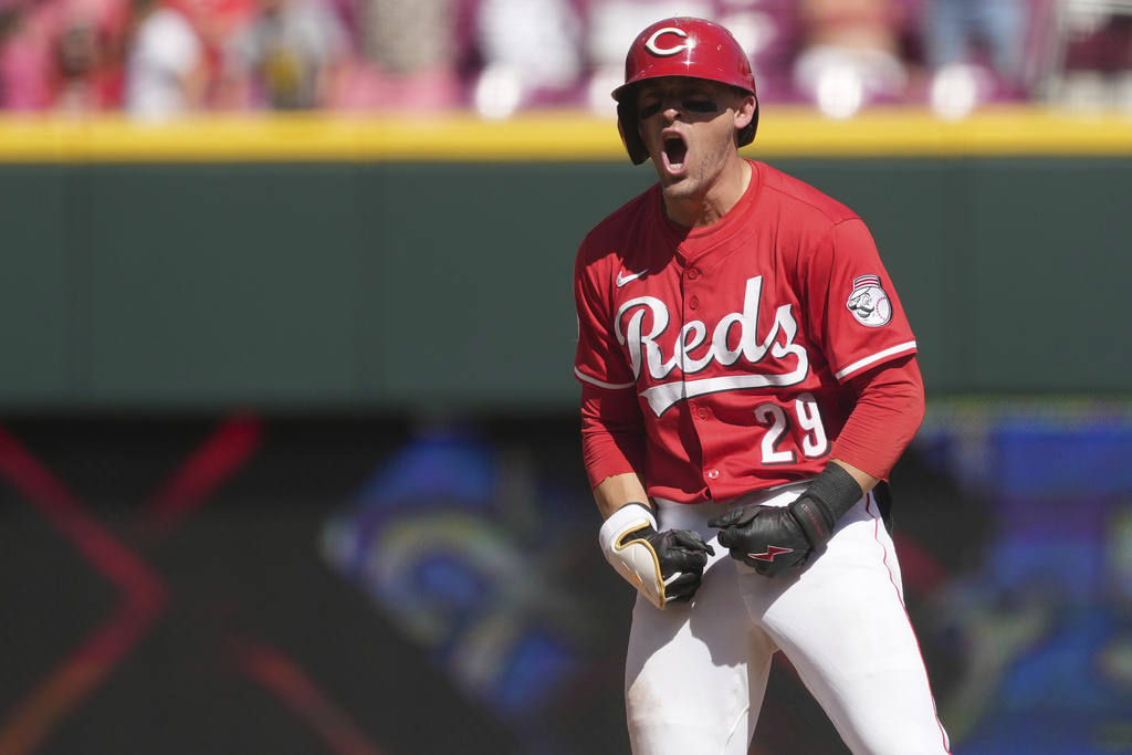 Cincinnati Reds' TJ Friedl reacts after hitting a one-run double in the ninth inning of a baseball game against the Toronto Blue Jays, Monday, Sept. 1, 2025, in Cincinnati. (AP Photo/Kareem Elgazzar)