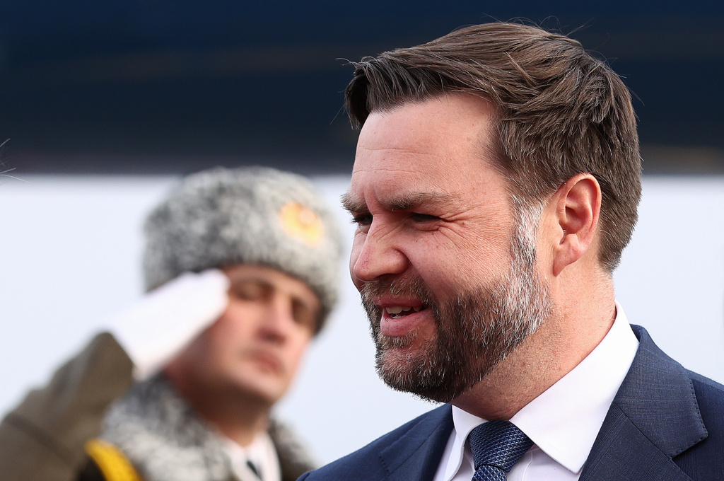 An honor guard member salutes as U.S. Vice President JD Vance arrives in Yerevan, Armenia, Monday, Feb. 9, 2026. (Kevin Lamarque/Pool Photo via AP)