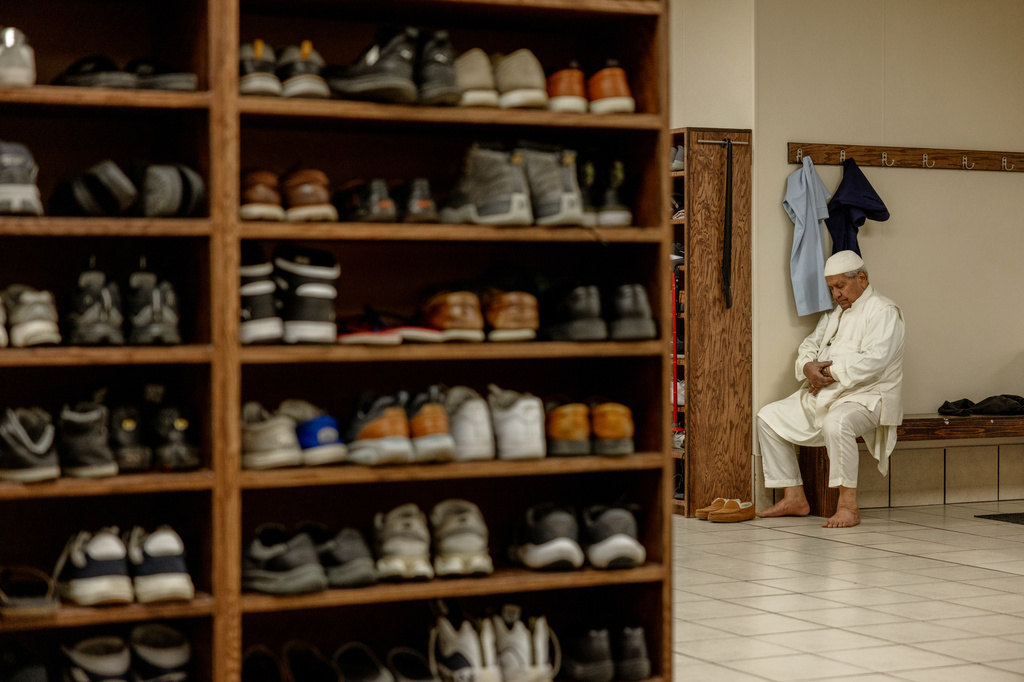 FILE - A man prays at the Islamic Society of Tulsa, Friday, Feb. 13, 2026, in Tulsa, Okla. (AP Photo/Brittany Bendabout, File)
