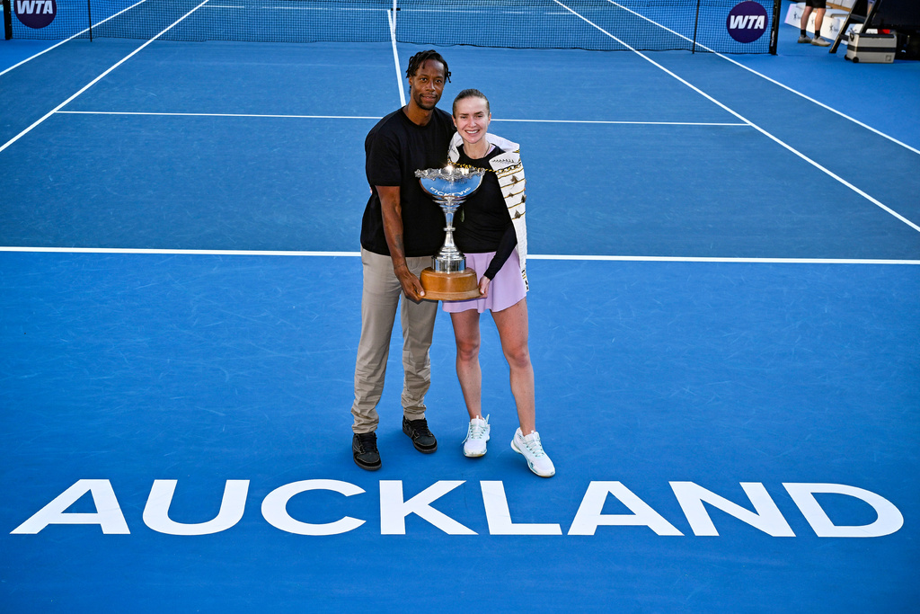 Elina Svitolina of Ukraine stands with her husband, French tennis player Gael Monfils, after defeating Wang Xinju of China in the women's single final of the ASB Classic women's tennis tournament in Auckland, New Zealand on Sunday 11 Jan. 2026. (Alan Lee/Photosport via AP)