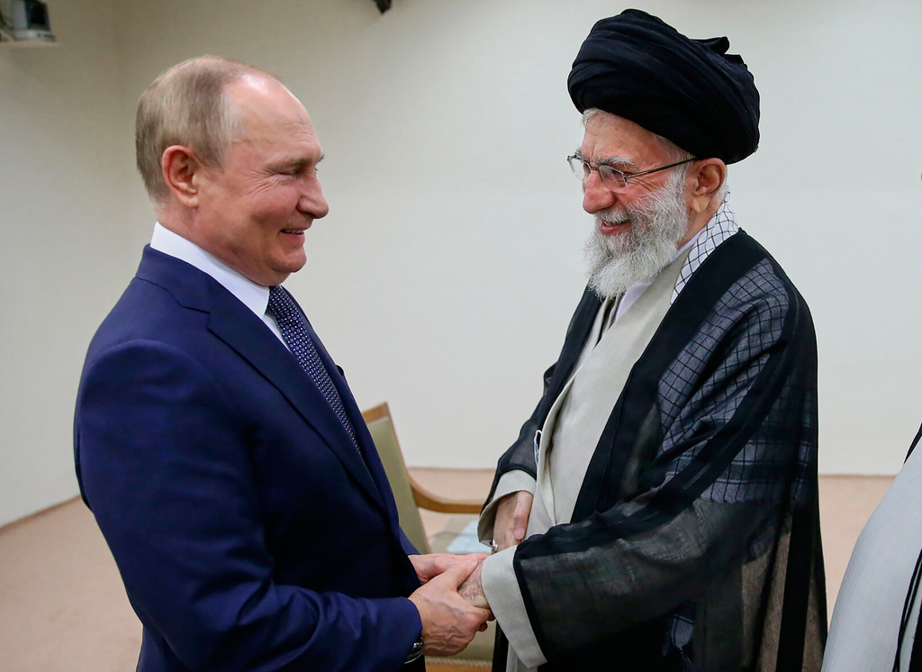 FILE - In this picture released by the official website of Iranian Supreme Leader Ayatollah Ali Khamenei, he and Russian President Vladimir Putin greet each other on July 19, 2022, during a meeting in Tehran, Iran. (Office of the Iranian Supreme Leader via AP, File)