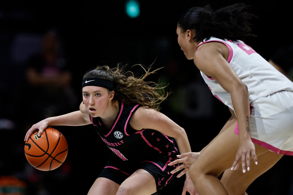 Vanderbilt guard Aubrey Galvan (3) drives against Oklahoma forward Brooklyn Stewart (21) during the first half of an NCAA college basketball game, Monday, Feb. 9, 2026, in Nashville, Tenn. (AP Photo/Wade Payne)