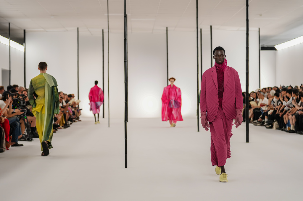 Models wear creations as part of the Issey Miyake Homme Spring Summer 2027 collection presented in Paris, France, Thursday, June 25, 2026. (AP Photo/Aurelien Morissard)