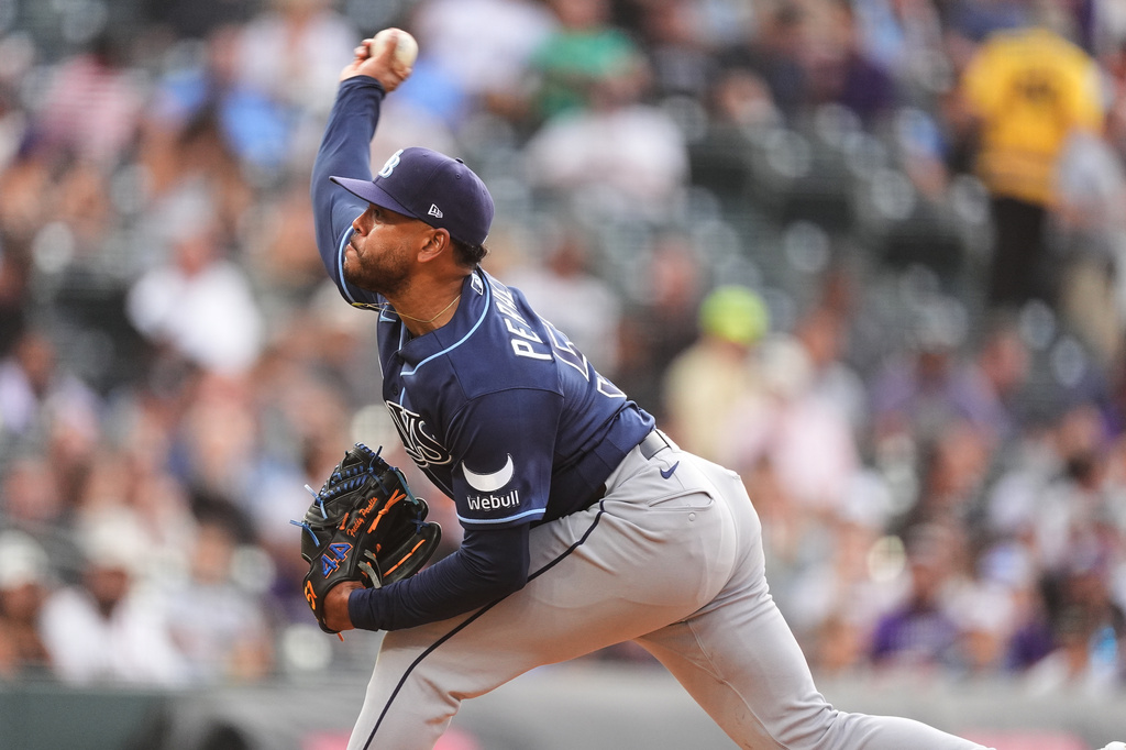 Tampa Bay Rays starting pitcher Freddy Peralta works against the Colorado Rockies in the first inning of a baseball game Tuesday, Aug. 4, 2026, in Denver. (AP Photo/David Zalubowski)