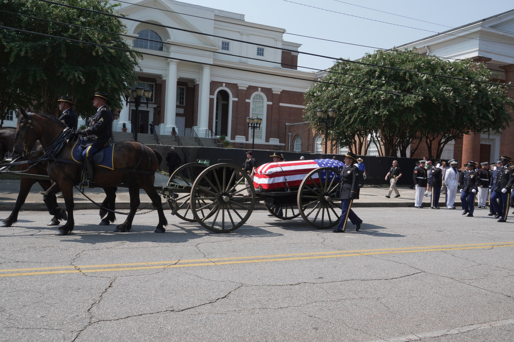 U.S. Sen. Lindsey Graham's casket on a horse-drawn caisson arrives at First Baptist Church in Columbia, S.C., on Wednesday, July 29, 2026. (AP Photo/Allen G. Breed)