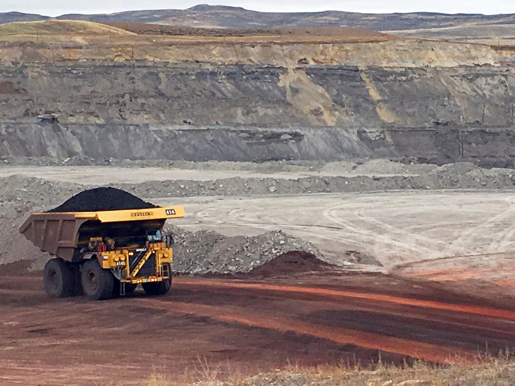 FILE - A dump truck hauls coal at the Eagle Butte Mine, now owned by Eagle Specialty Materials, LLC, near Gillette, Wyo., March 28, 2017. (AP Photo/Mead Gruver, File)