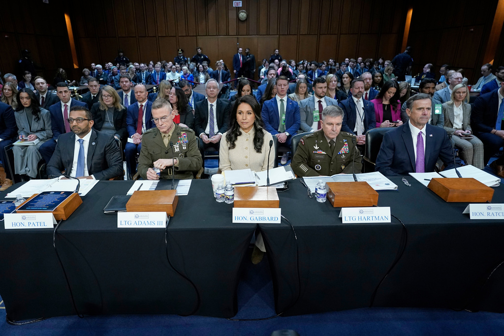 From left, FBI Director Kash Patel, Defense Intelligence Agency Director James Adams, Director of National Intelligence Tulsi Gabbard, Acting Commander of the U.S. Cyber Command William Hartman, and CIA Director John Ratcliffe are seated before the Senate Committee on Intelligence hearings to examine worldwide threats on Capitol Hill Wednesday, March 18, 2026, in Washington. (AP Photo/Jose Luis Magana)