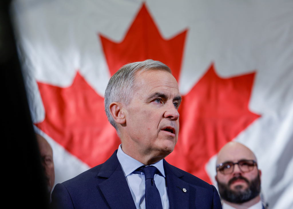 Prime Minister Mark Carney meets with ironworkers in Calgary, Alta., Thursday, Nov. 27, 2025. (Jeff McIntosh /The Canadian Press via AP)