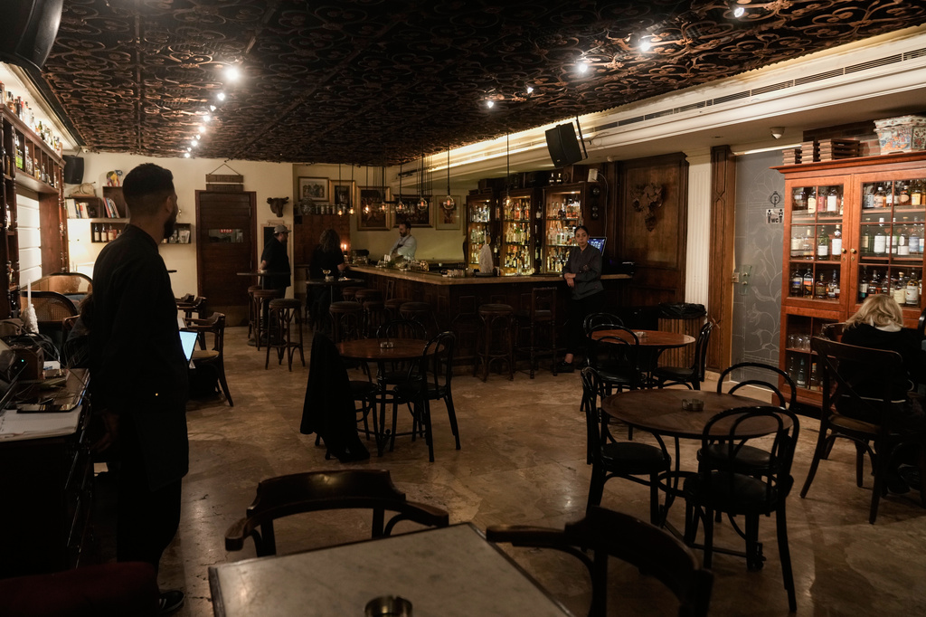 People spend time at an almost empty bar on Hamra Street in Beirut, Lebanon, May 5, 2026. (AP Photo/Bilal Hussein)