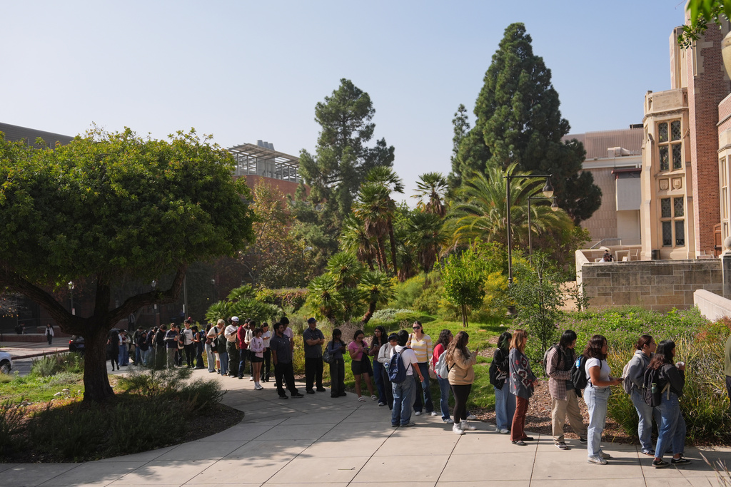 Voters form a line at a polling station on the UCLA campus Tuesday, Nov. 4, 2025, in Los Angeles. (AP Photo/Jae C. Hong)