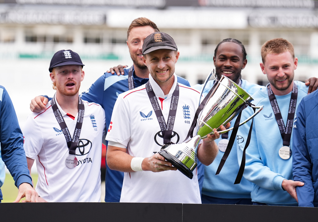 England players, including captain Joe Root, celebrate following their series win over Pakistan, on day four of the third cricket Test at Edgbaston, in Birmingham, England, Saturday, Sept. 12, 2026. (Mike Egerton/PA via AP)