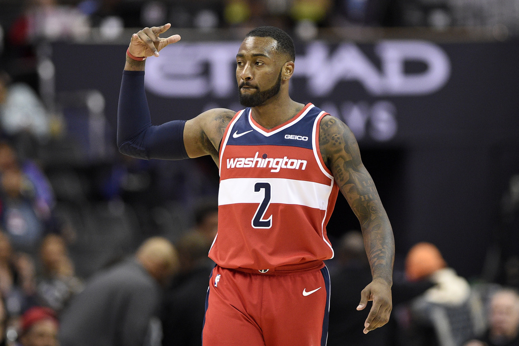 FILE - Washington Wizards guard John Wall gestures after hitting a 3-point basket during the second half of the team's NBA basketball game against the Brooklyn Nets, Saturday, Dec. 1, 2018, in Washington. (AP Photo/Nick Wass, File)