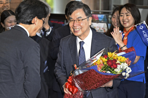 Osaka University professor Dr. Shimon Sakaguchi, right, receives flowers in Suita, near Osaka, western Japan, Tuesday, Oct. 7, 2025, a day after he won the Nobel Prize in medicine. (Yu Nakajiyama/Kyodo News via AP) Osaka University professor Dr. Shimon Sakaguchi, right, receives flowers in Suita, near Osaka, western Japan, Tuesday, Oct. 7, 2025, a day after he won the Nobel Prize in medicine. (Yu Nakajiyama/Kyodo News via AP)