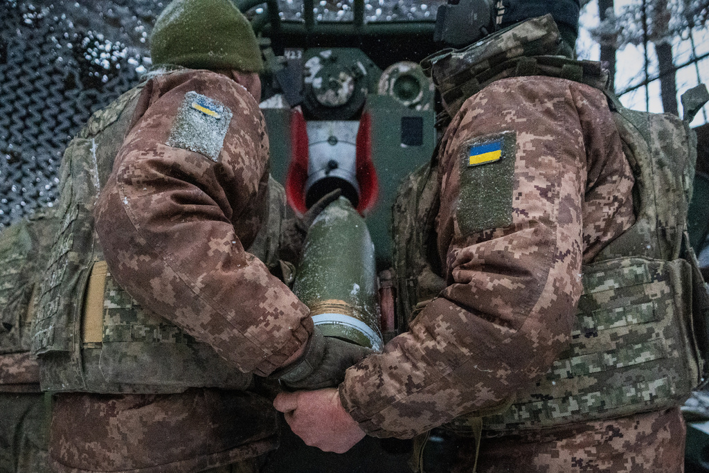 FILE - Ukrainian servicemen load an artillery shell before firing at Russian positions on the front line in Kharkiv region of Ukraine, Wednesday, Feb. 18, 2026. (AP Photo/Andrii Marienko, File)