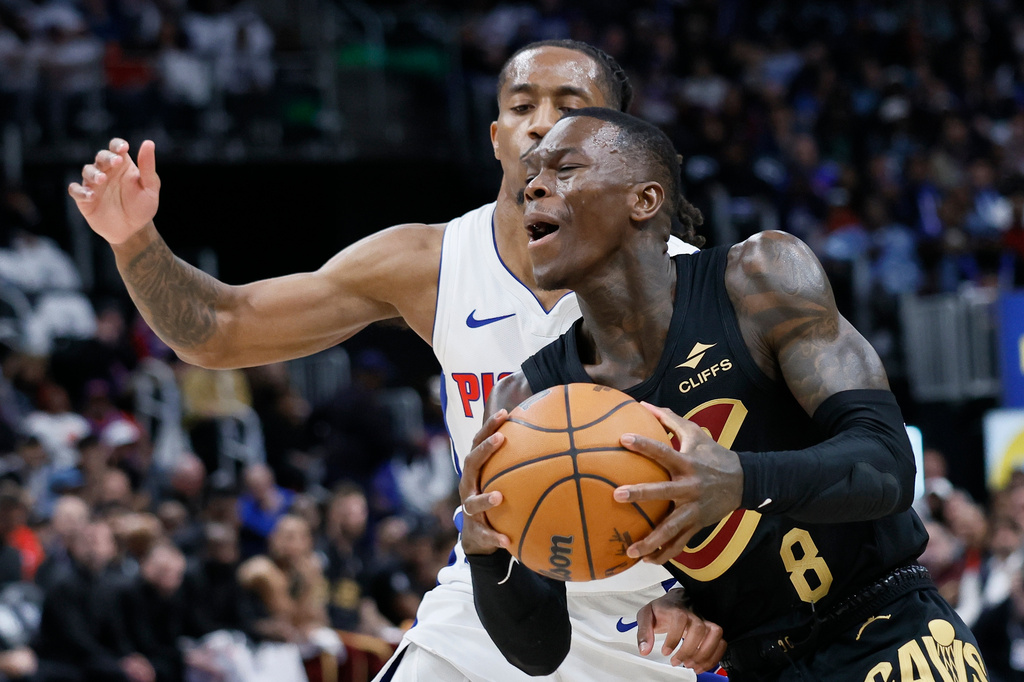 Cleveland Cavaliers guard Dennis Schroder (8) drives to the basket against Detroit Pistons guard Daniss Jenkins (24) during the first half in Game 1 of a second-round NBA playoffs basketball series Tuesday, May 5, 2026, in Detroit. (AP Photo/Duane Burleson)