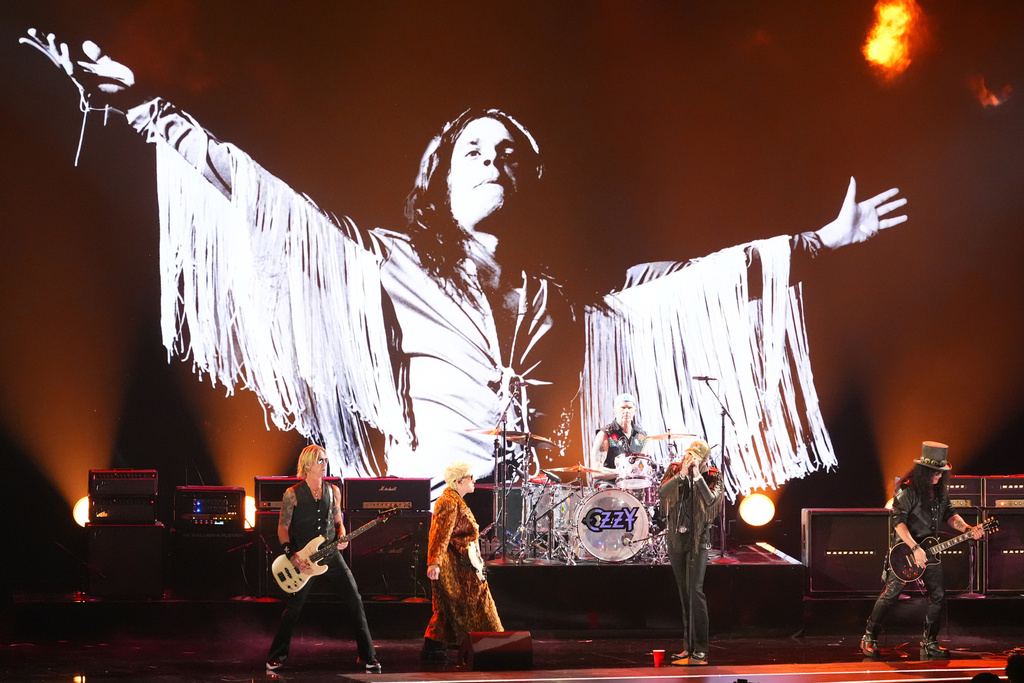 Duff McKagan, from left, Andrew Watt, Chad Smith, Post Malone and Slash perrform "War Pigs" during the in memoriam tribute for the 68th annual Grammy Awards on Sunday, Feb. 1, 2026, in Los Angeles. (AP Photo/Chris Pizzello)