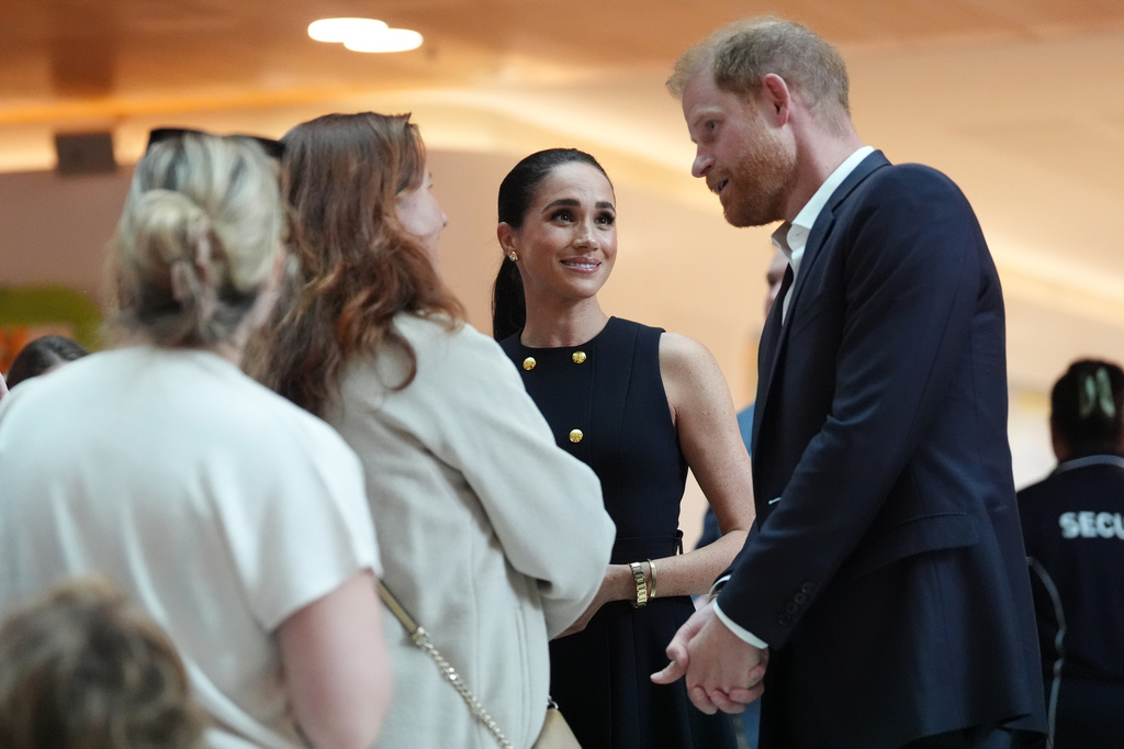 Britain's Prince Harry and Meghan Markle, the Duke and Duchess of Sussex, visit the Royal Children's Hospital Melbourne, Australia Tuesday, April 14, 2026. (Jonathan Brady/Pool Photo via AP)