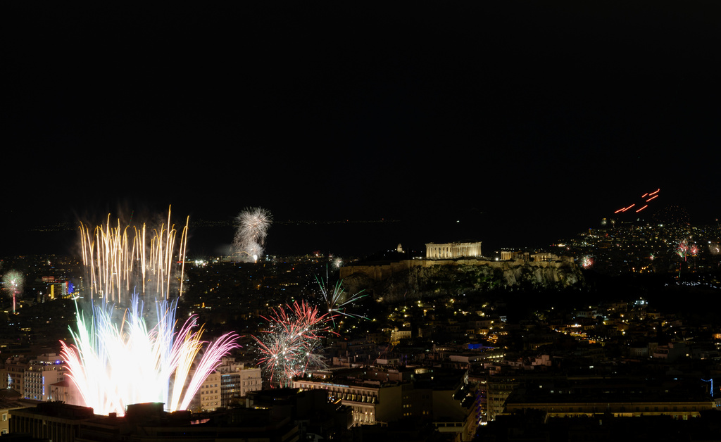 Fireworks burst over the Greek capital during New Year celebrations in Athens, Greece, early Thursday, Jan. 1, 2026. (AP Photo/Yorgos Karahalis)