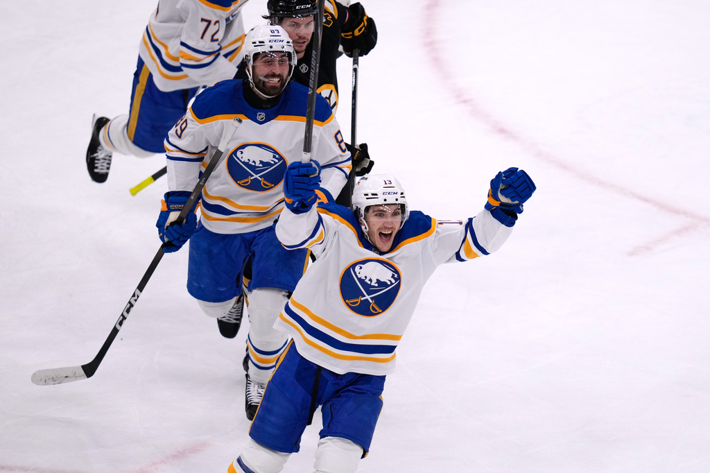 Buffalo Sabres center Peyton Krebs, front, celebrates after a goal by Mattias Samuelsson during the first period in Game 6 of a first-round NHL hockey Stanley Cup playoff series against the Boston Bruins, Friday, May 1, 2026, in Boston. (AP Photo/Charles Krupa)