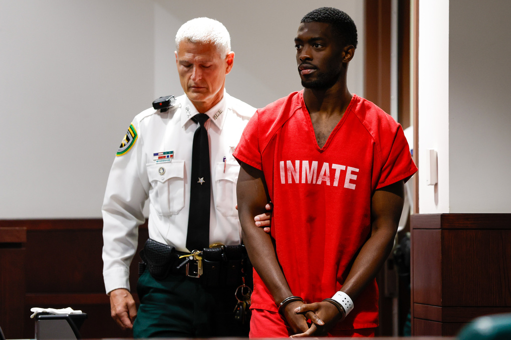 Terrion Arnold, a Detroit Lions cornerback, is brought out by a Hillsborough County officer before his pretrial detention hearing at the Hillsborough County Courthouse on Monday, June 29, 2026, in Tampa, Fla. (Jefferee Woo/Tampa Bay Times via AP)