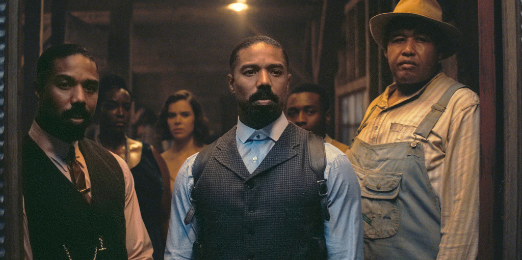 This image released by Warner Bros Pictures shows Michael B. Jordan, foreground from left, Michael B. Jordan and Omar Benson Miller in a scene from "Sinners." (Warner Bros. Pictures via AP)