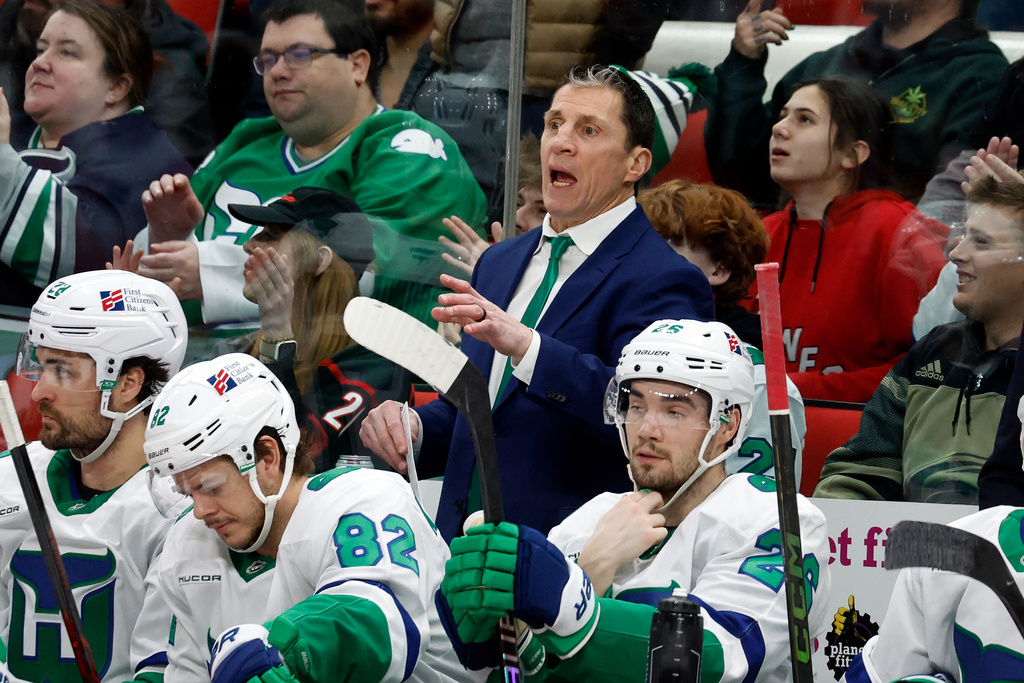 Carolina Hurricanes head coach Rod Brind'Amour, center top, protests a call during the third period of an NHL hockey game against the Utah Mammoth in Raleigh, N.C., Thursday, Jan. 29, 2026. (AP Photo/Karl DeBlaker)