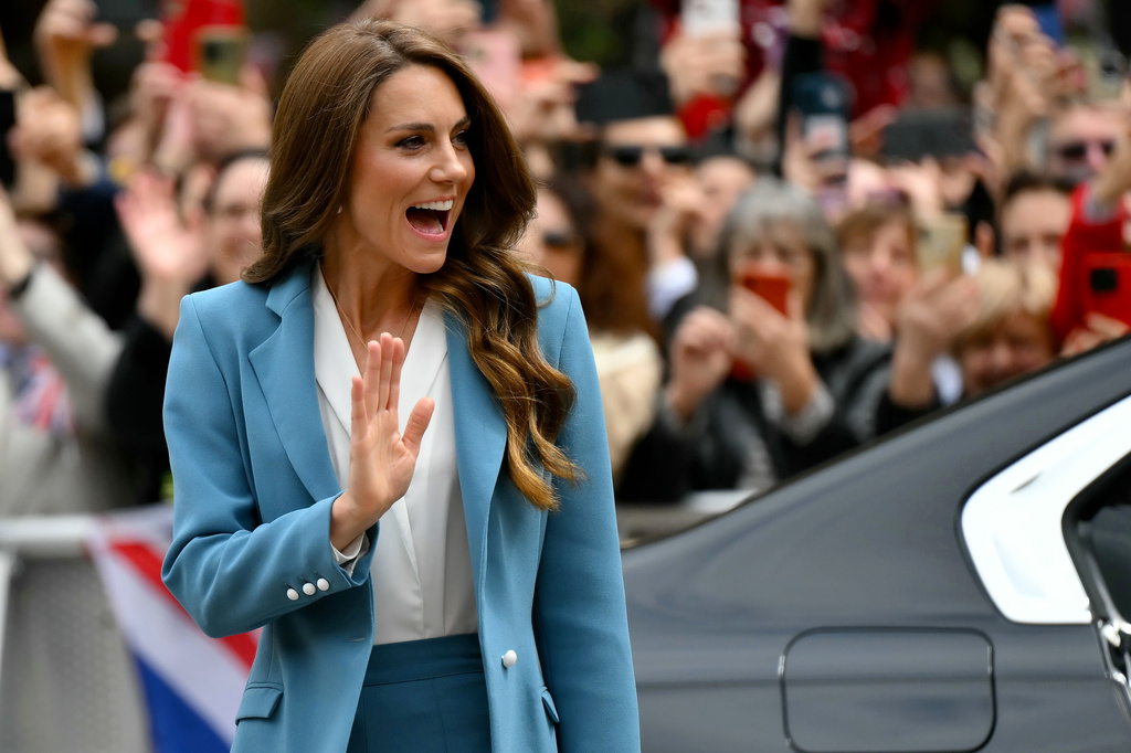 Britain's Kate, Princess of Wales, waves as she arrives at the town hall, part of a two-day trip, in Reggio Emilia, Italy, Wednesday, May 13, 2026. (Marco Bertorello/Pool Photo via AP)