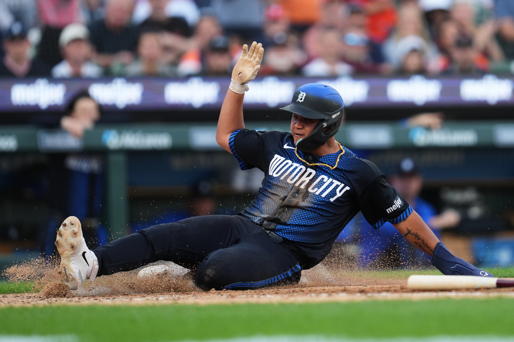 Detroit Tigers' Hao-Yu Lee slides safely into home plate against the New York Yankees during the fourth inning of a baseball game Monday, June 22, 2026, in Detroit. (AP Photo/Paul Sancya)