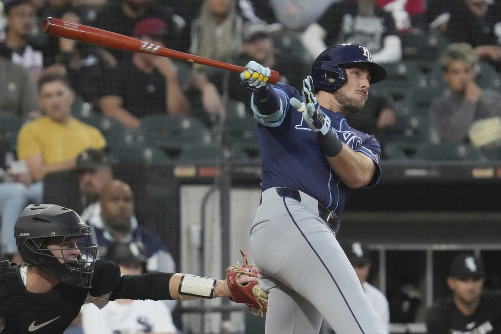 Tampa Bay Rays' Josh Lowe hits a two-run home run during the second inning of a baseball game against the Chicago White Sox in Chicago, Tuesday, Sept. 9, 2025. (AP Photo/Nam Y. Huh)