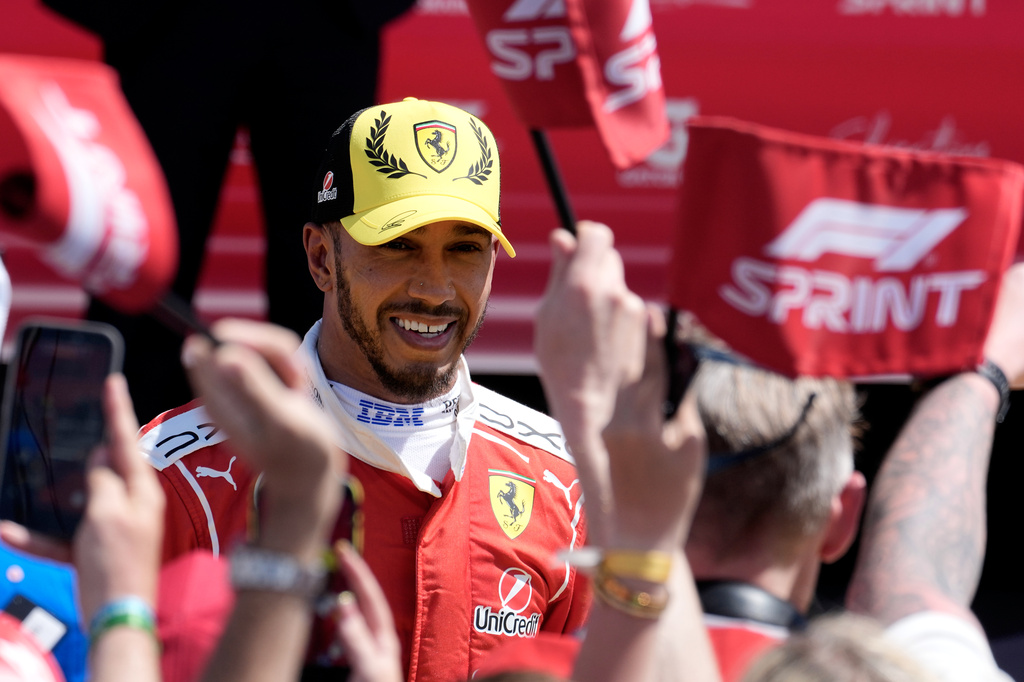 Ferrari driver Lewis Hamilton of Britain celebrates his second position after the sprint race ahead of the British F1 Grand Prix, in Silverstone, England, Saturday, July 4, 2026. (AP Photo/Darko Bandic)