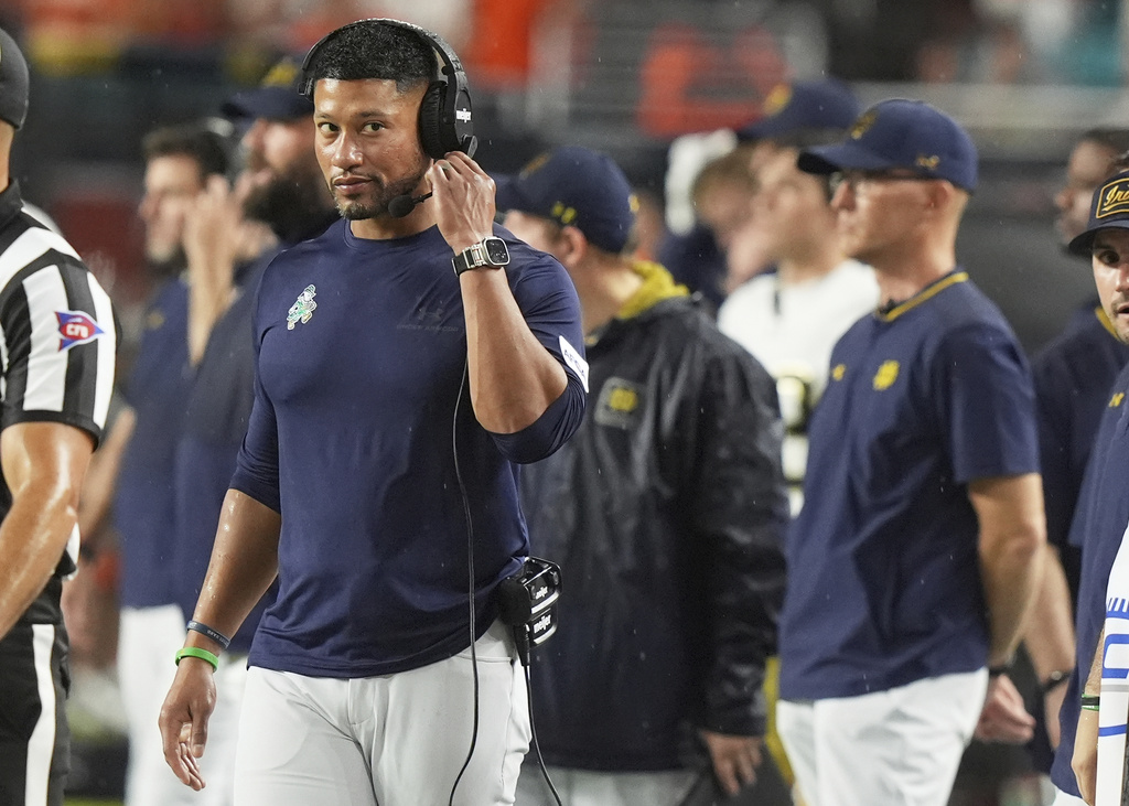Notre Dame head coach Marcus Freeman stands on the sideline during the first half of an NCAA college football game against Miami, Sunday, Aug. 31, 2025, in Miami Gardens, Fla. (AP Photo/Lynne Sladky)