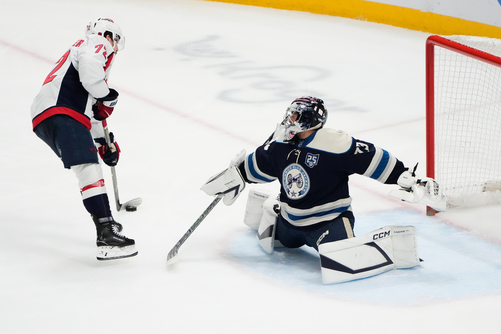 Washington Capitals right wing Anthony Beauvillier (72) scores on Columbus Blue Jackets goaltender Jet Greaves in the second period of an NHL hockey game Tuesday, April 14, 2026, in Columbus, Ohio. (AP Photo/Sue Ogrocki)