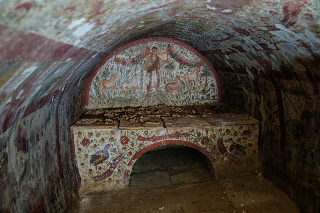 A fresco depicting Jesus as the "Good Shepherd" adorns the wall of a 3rd-century tomb in Hisardere, where archaeologists uncovered one of Anatolia's best-preserved early Christian artworks, in Iznik, Turkey, Friday, Dec. 12, 2025. (AP Photo/Khalil Hamra)